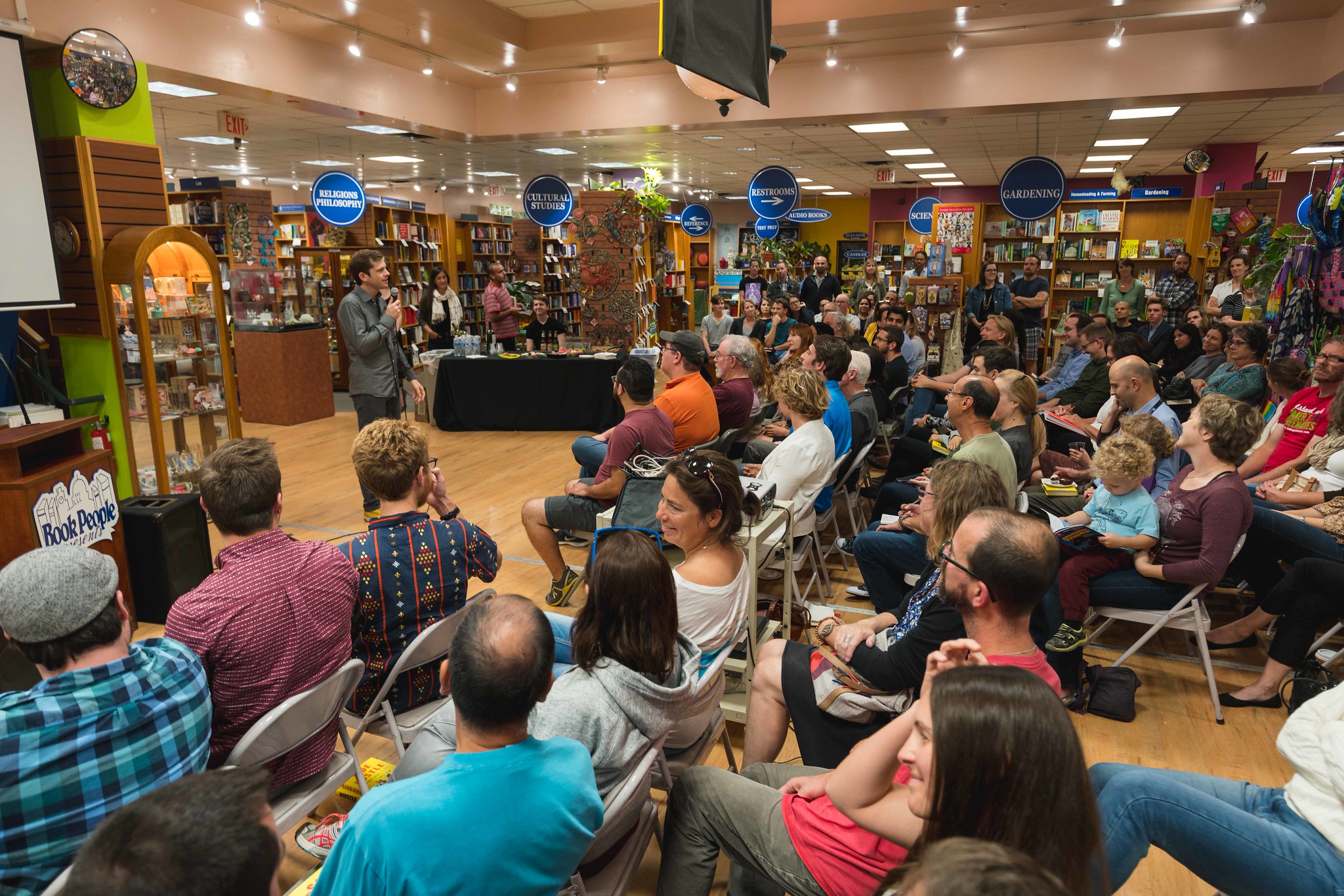 Chris Guillebeau speaking at BookPeople in Austin, Texas during the Side Hustle book tour